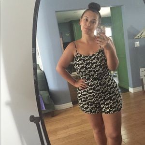 Adorable bow romper with open back